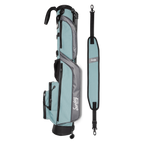 A full shot of Loma golf bag in seafoam laying flat sideways beside its single strap
