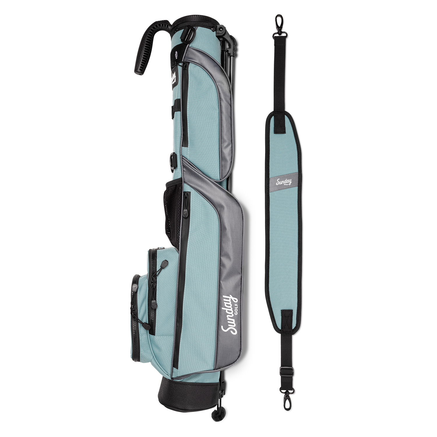 A full shot of Loma golf bag in seafoam laying flat sideways beside its single strap