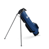 A full shot of standing Loma XL golf bag in cobalt blue facing backward