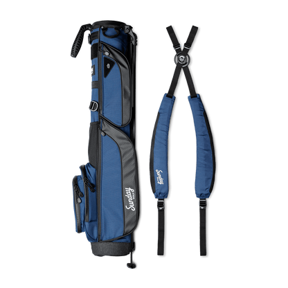 A full shot of Loma XL golf bag in cobalt blue laying flat sideways beside its double strap