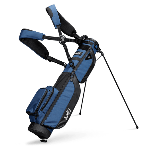 A full front shot of standing Loma XL golf bag in cobalt blue with double strap