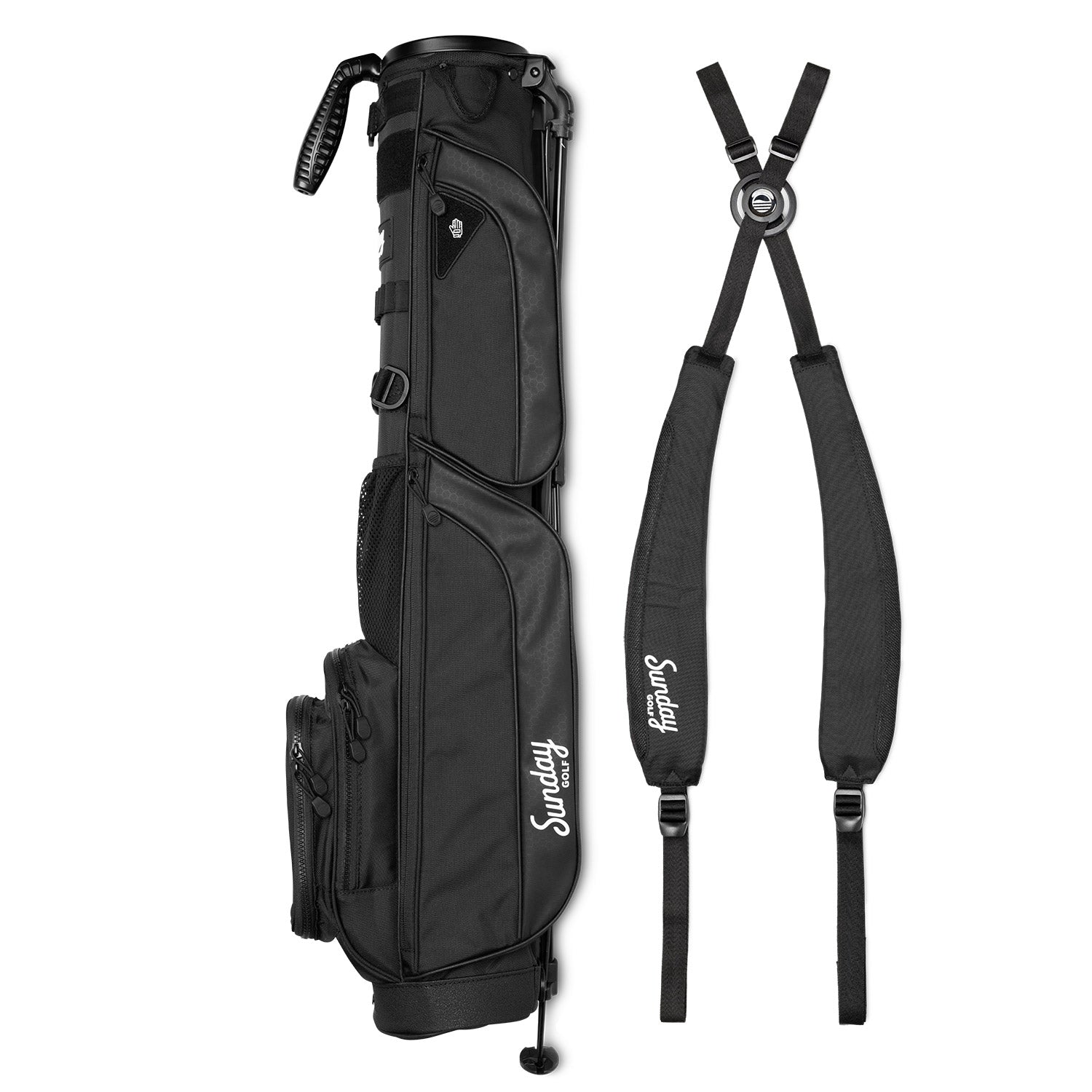A full shot of Loma XL golf bag in matte black laying flat sideways beside its double strap