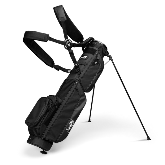 A full front shot of standing Loma XL golf bag in matte blackl with double strap