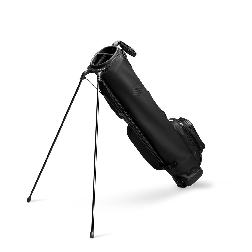 A full shot of standing Loma XL S-Class golf bag in black vegan leather facing backward