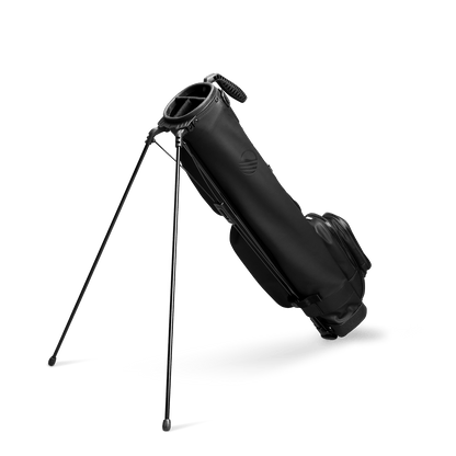 A full shot of standing Loma XL S-Class golf bag in black vegan leather facing backward