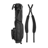 A full shot of Loma XL S-Class golf bag in black vegan leather laying flat sideways beside its double strap