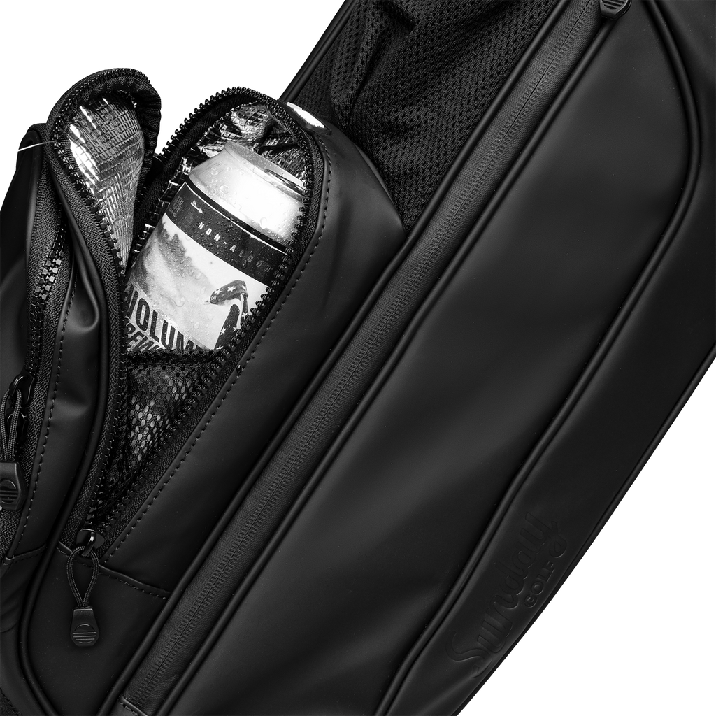 A close up shot of black vegan leather Loma XL S-Class golf bag's frosty pocket with a canned drink inside