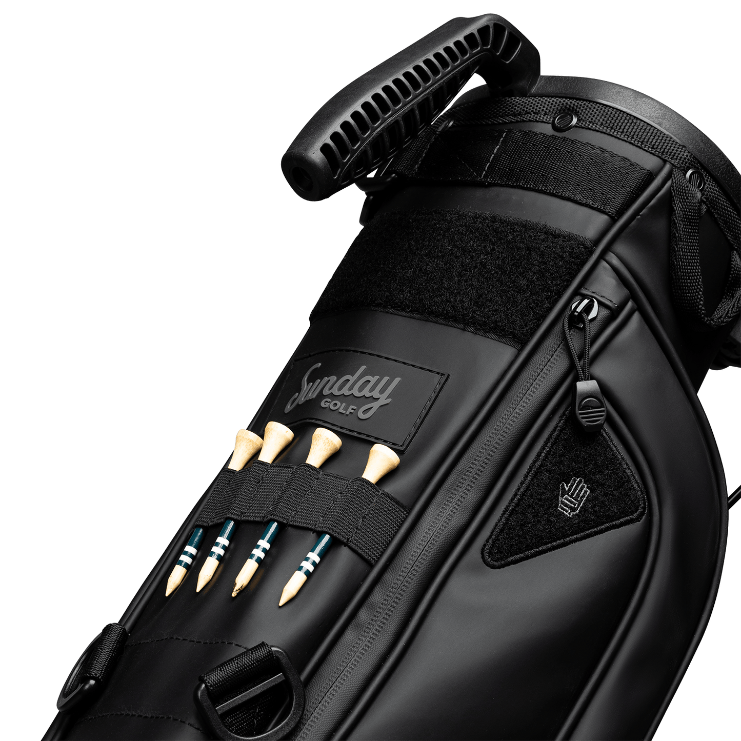 A close up of Loma XL S-Class golf bag in black vegan leather showing the front with bamboo golf tees