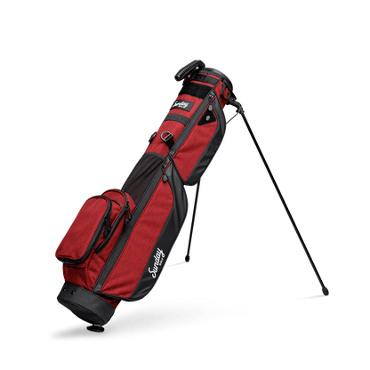 A full shot of standing Loma XL golf bag in deep red burgundy facing to the front