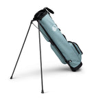 A full shot of standing Loma XL golf bag in seafoam green facing backward