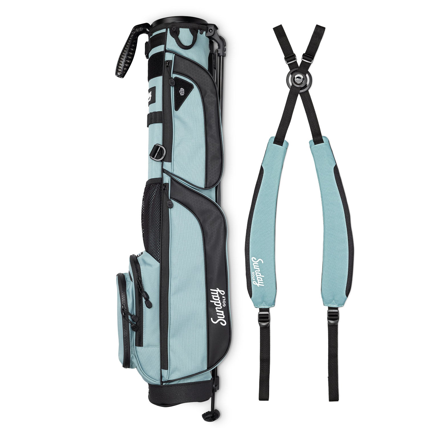 A full shot of Loma XL golf bag in seafoam green laying flat sideways beside its double strap