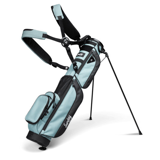 A full front shot of standing Loma XL golf bag in seafoam green with double strap