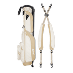 A full shot of Loma XL golf bag in toasted almond laying flat sideways beside its double strap