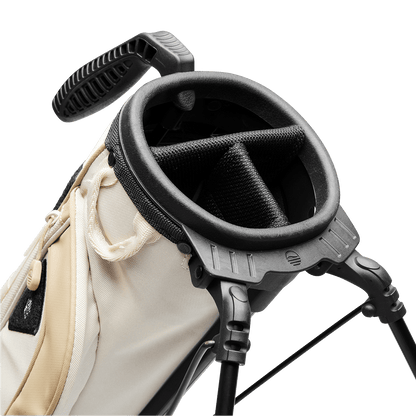 A close up top view of a toasted almond Loma XL golf bag's 3-way divider