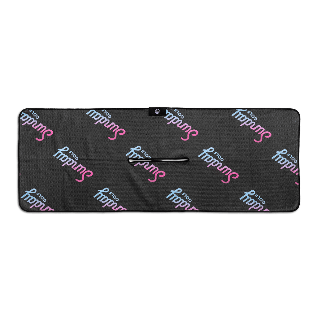 Rear view of black golf towel with ombre pink and teal colors