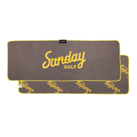 brown and yellow golf towel by Sunday Golf