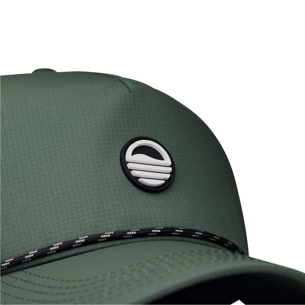Close up shot of olive green Porter Lite golf hat showing Sunday Golf logo