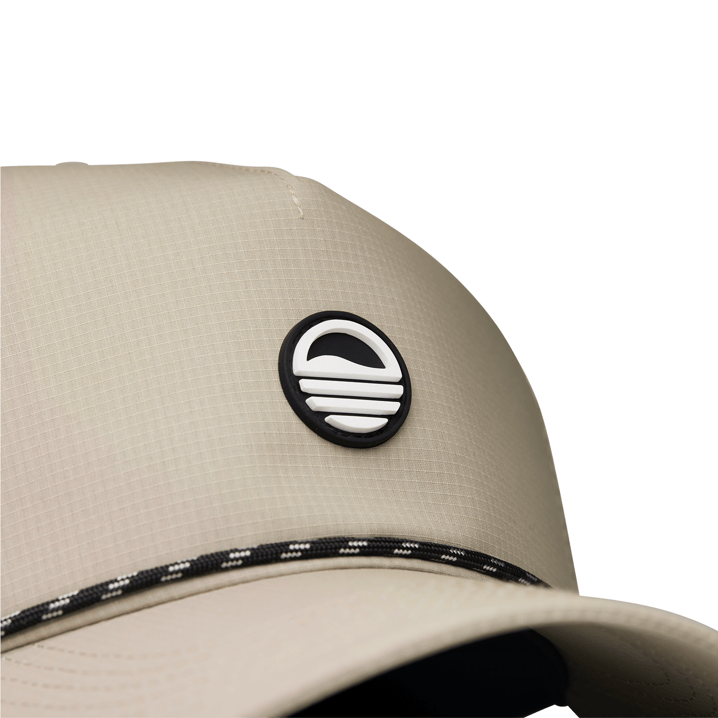 Close up shot of tan Porter Lite golf hat showing Sunday Golf logo