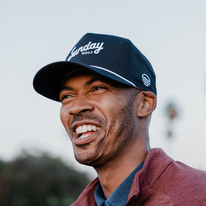 A man wearing navy rope golf hat by Sunday Golf