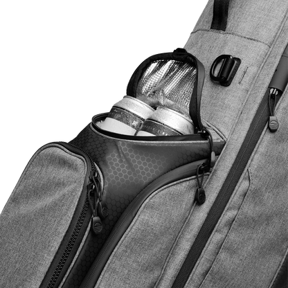 A close up shot of heather gray Ryder golf bag's frosty pocket with canned drinks inside
