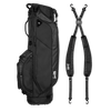 A full shot of Ryder golf bag in matte black laying flat sideways beside its double strap