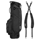 A full shot of Ryder golf bag in matte black laying flat sideways beside its double strap