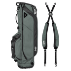 A full shot of Ryder golf bag in midnight green laying flat sideways beside its double strap