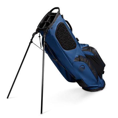 A full shot of standing Ryder golf bag in navy blue facing backward