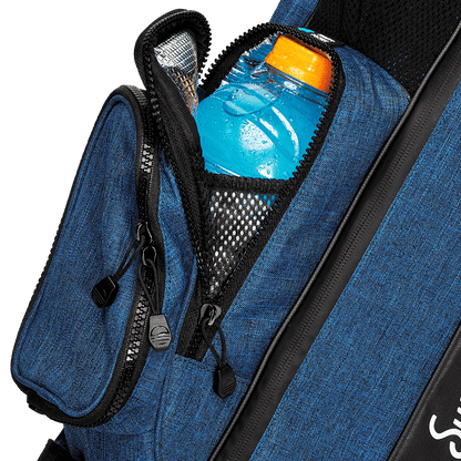 A close up shot of cobalt blue The Loma golf bag's frosty pocket with a cold drink inside