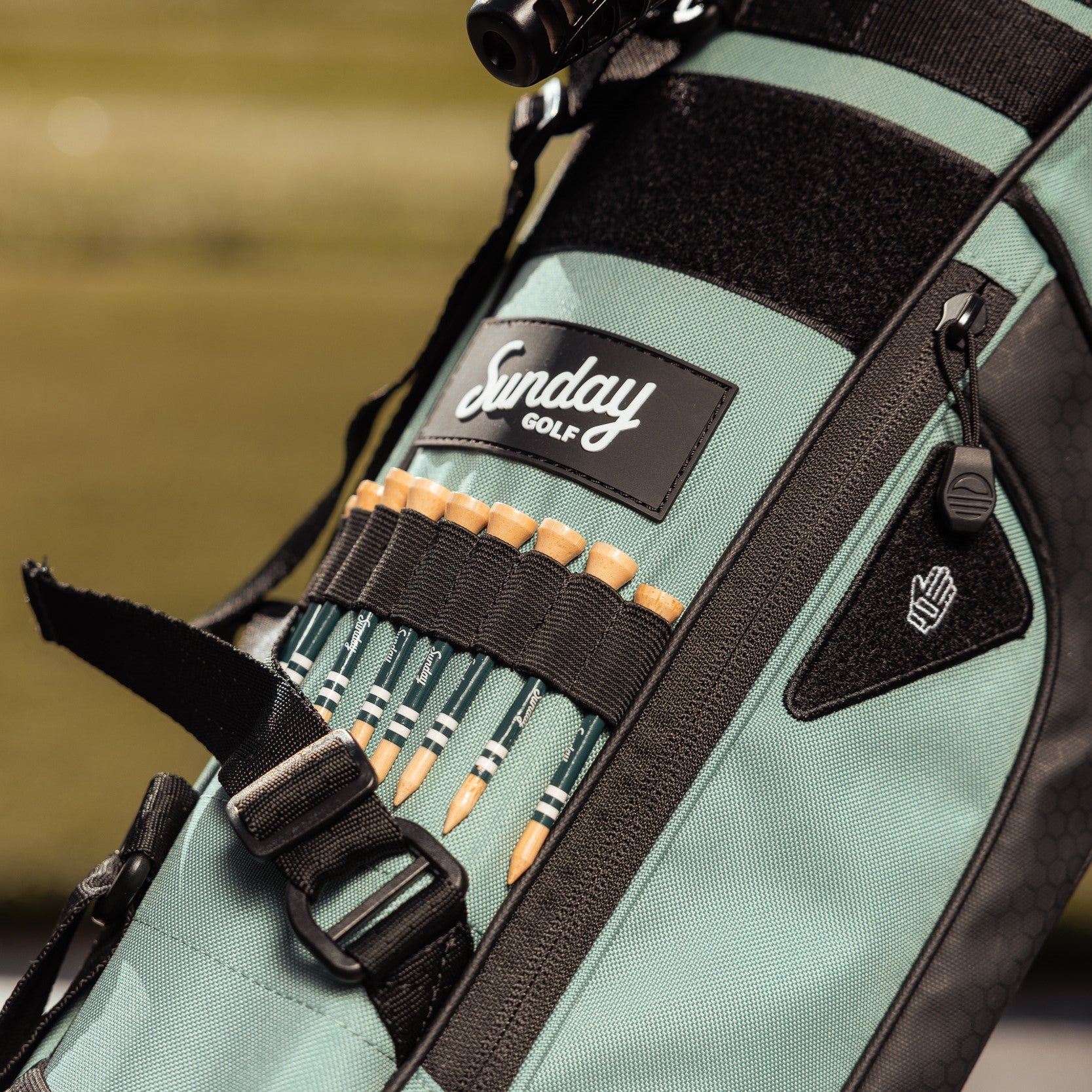 bamboo golf tees on seafoam Sunday golf bag